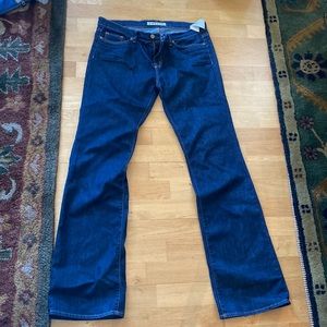 J. Brand dark wash jeans straight leg with a slight flare bottom. Size 32 NWT